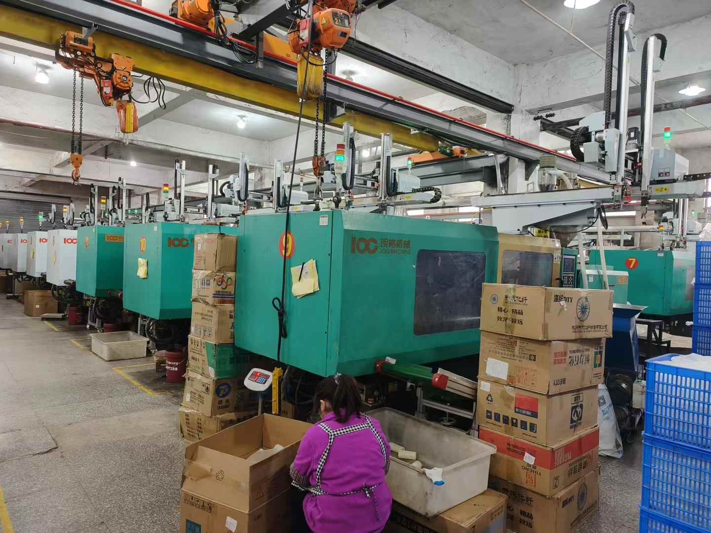 Injection-molding equipment on the factory floor.