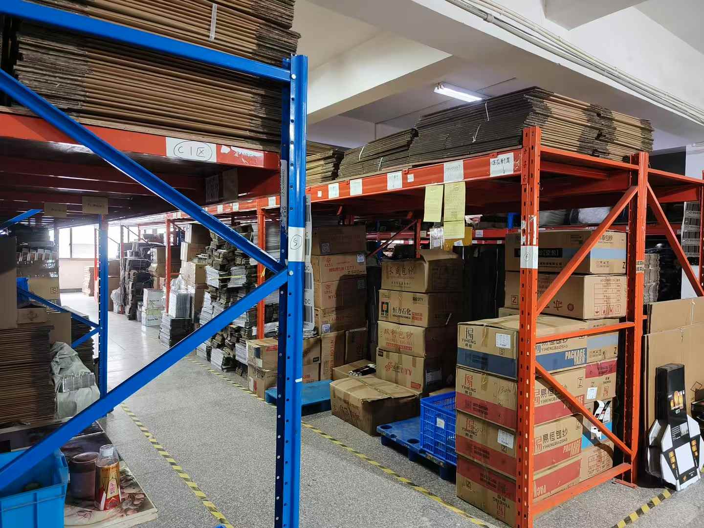 Cartons and packaging materials prepared for production.